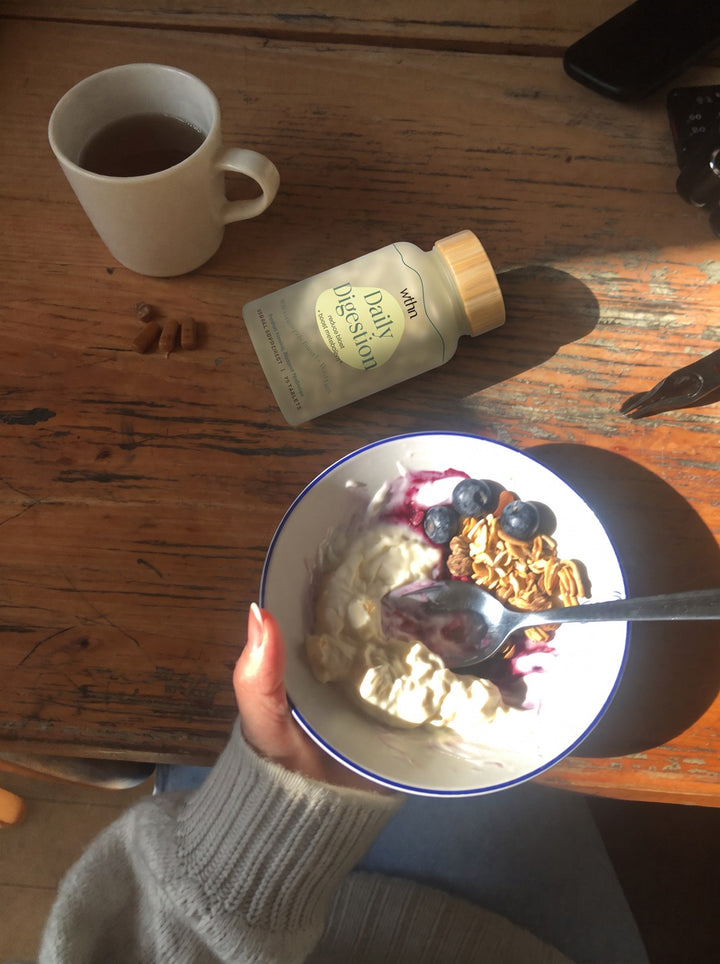 Breakfast from above: yogurt with blueberries, tea and a bottle of Daily Digestion