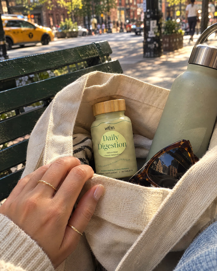 Daily Digestion in a tote bag on a city bench