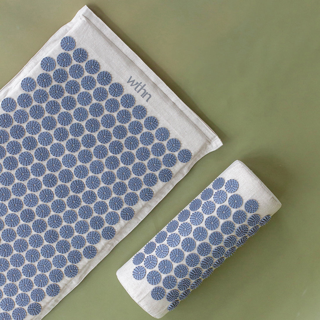 The WTHN acupressure mat and pillow, linen with periwinkle lotus stimulators